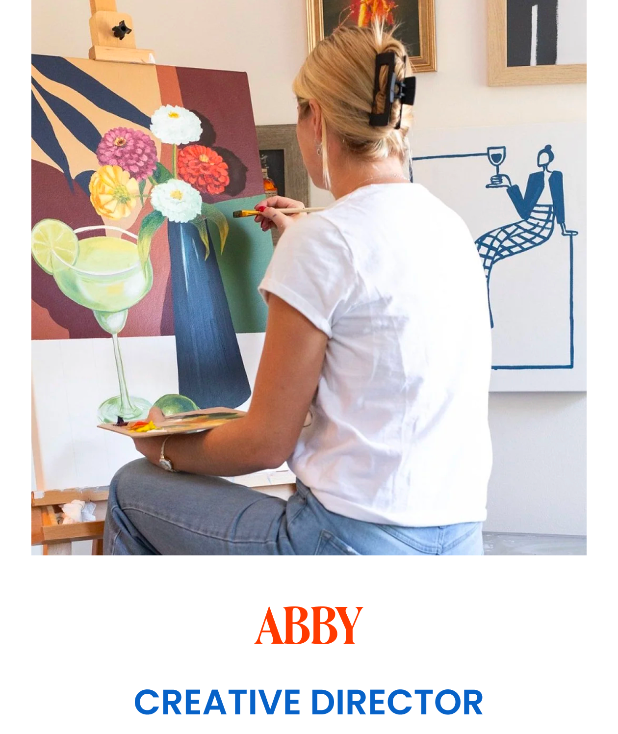 Image showing woman painting on a canvas with text indicating she is the creative director.