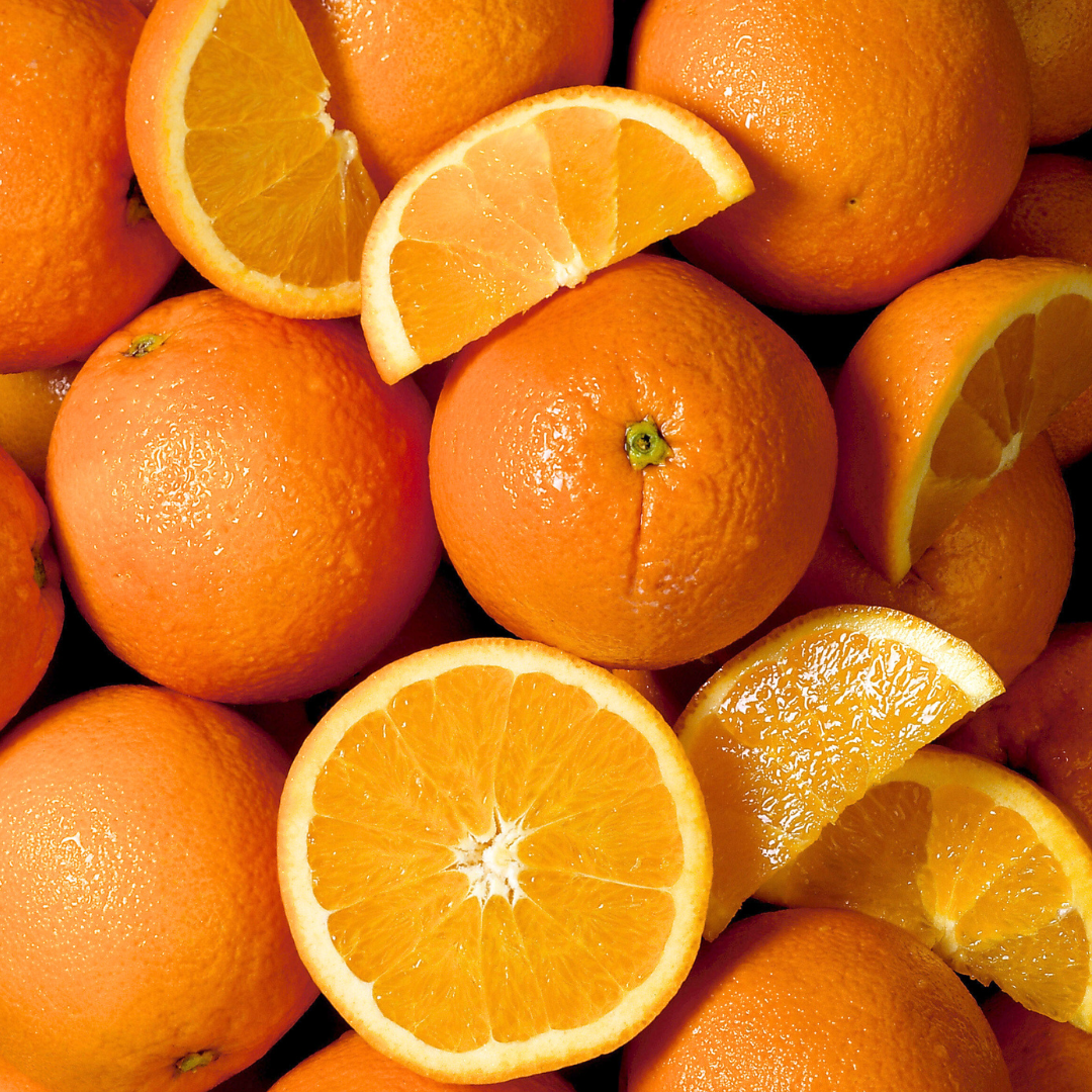 Oranges and orange slices on a pile
